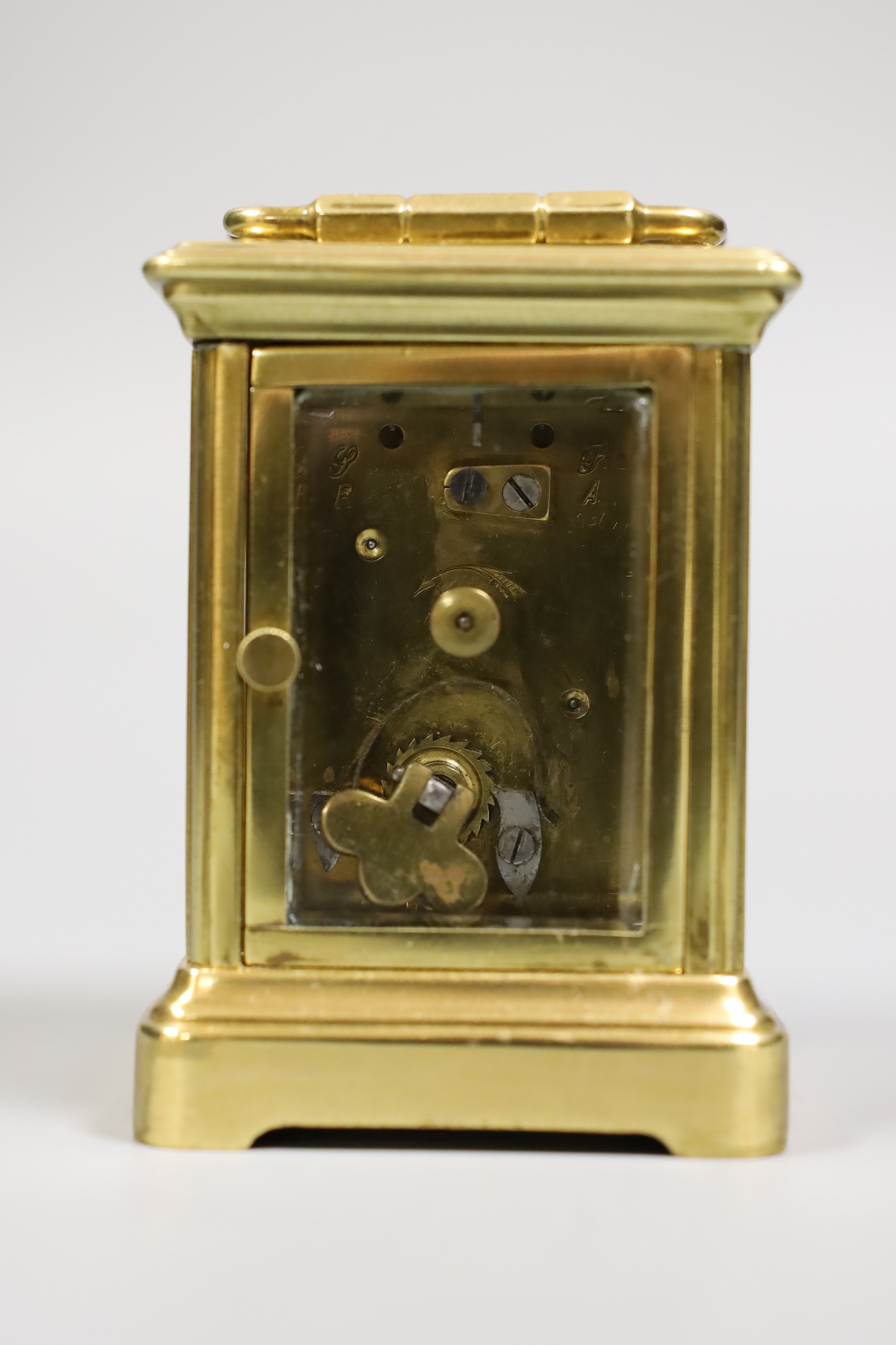 A miniature carriage timepiece, with enamelled side panels of Venice, 8 cms high